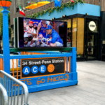 Penn Station entrance decorated in New York Knicks blue and orange during the teams 2026 playoff run.