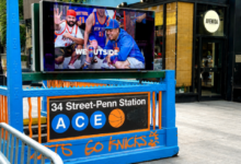 Penn Station entrance decorated in New York Knicks blue and orange during the teams 2026 playoff run.