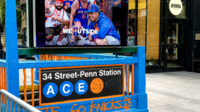 Penn Station entrance decorated in New York Knicks blue and orange during the teams 2026 playoff run.